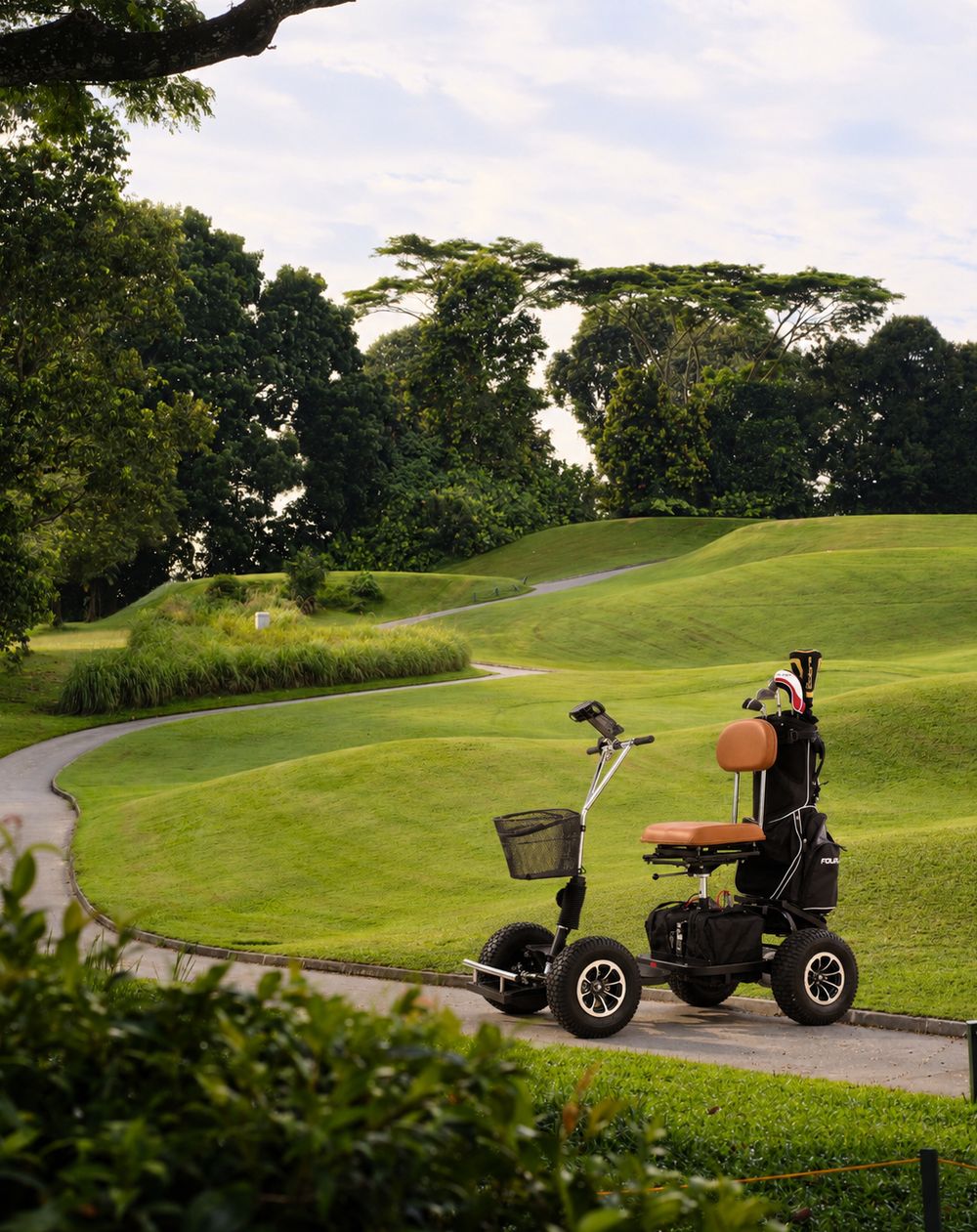 KETTAL G800 golf mobility scooter with golf bag on a golf course fairway